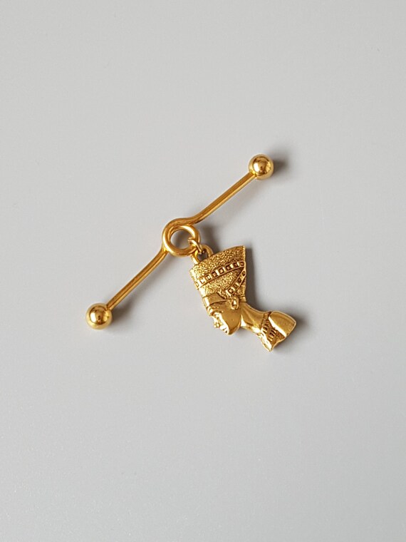 Nefertiti industrial barbell 14g Gold piercing Ear