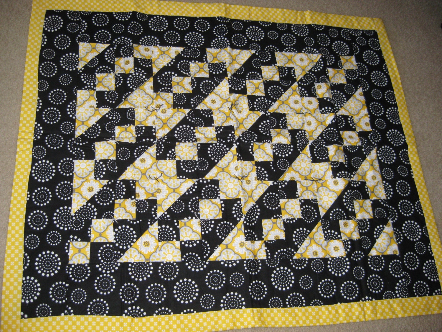 yellow-and-black-quilt-throw