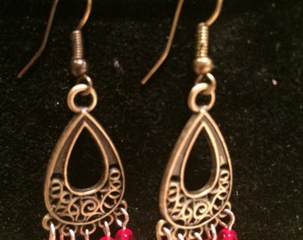 Items similar to Bronze effect beaded earrings on Etsy