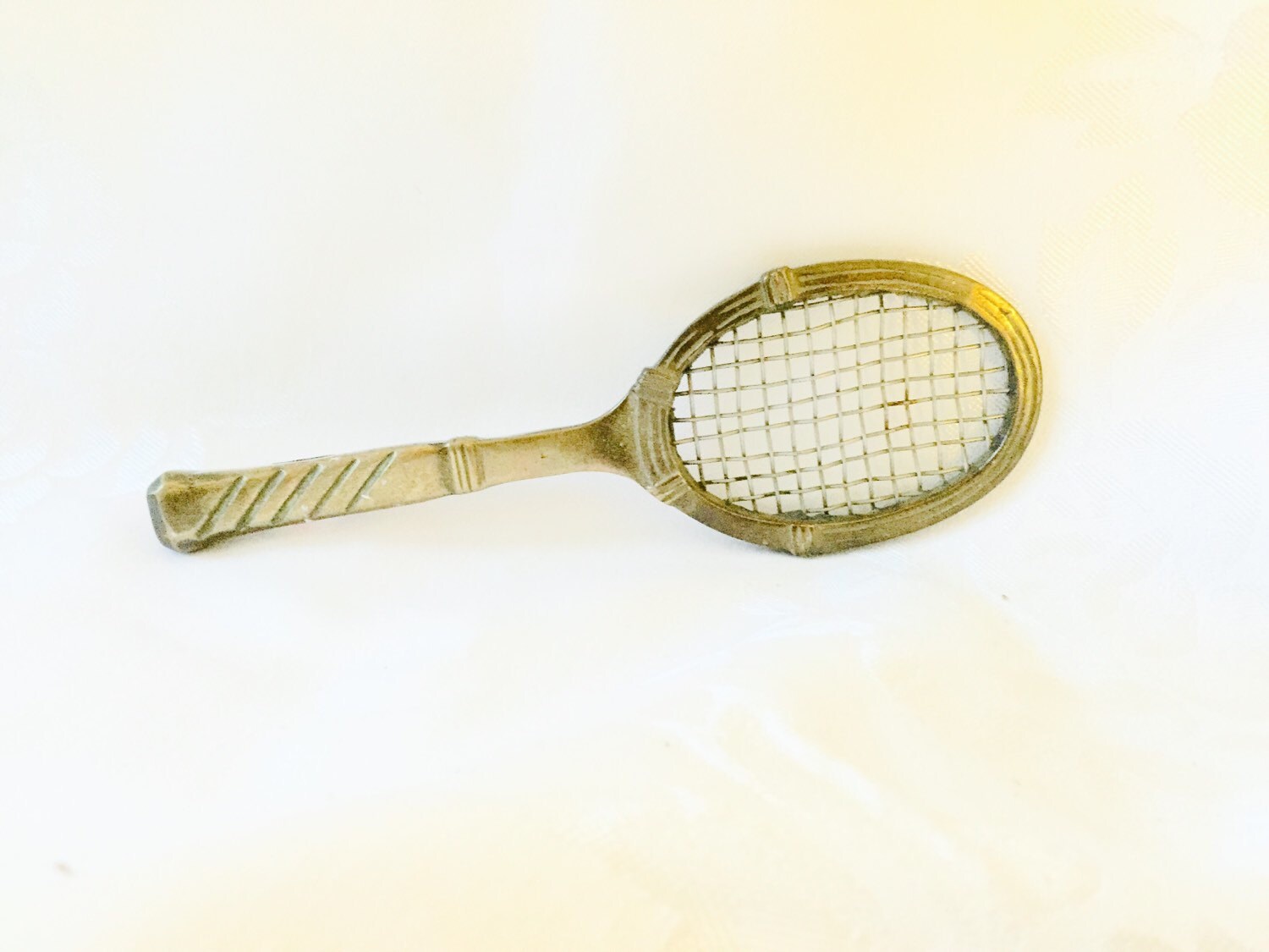 Miniature brass tennis racket Haute Juice
