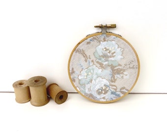 embroidery hoop art with crochet flower and recycled button