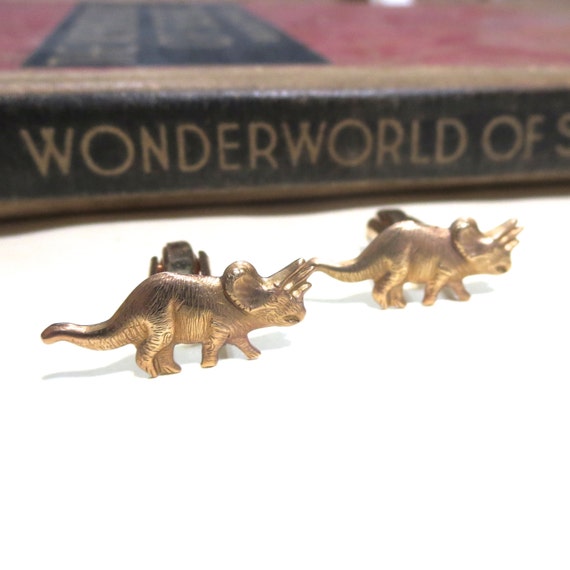 brass dinosaur figurine