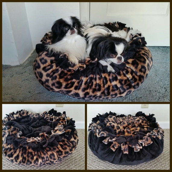 Marshmallow Pet Bed in a bold cheetah print with a solid
