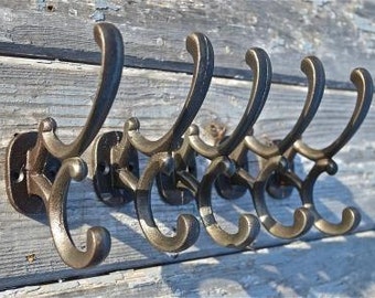 Set of 5 Addison antique style cast iron double coat hooks c/w screws