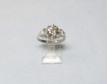 Old Mine Diamond Antique Engagement Ring Set in 18 Karat White Gold Eight Prong Fancy Basket Setting with Two Straight Diamond Baguettes