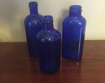 Items similar to Tall blue bottles, vintage cobalt glass, castor oil ...