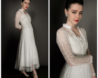 Vintage 40's lace wedding dress and long sleeved lace jacket, approx size 8 or a small 10, I have matched it with a beautiful 40's slip.