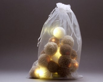 20 pom-pom LED fairy lights in chocolate , latte and cream pom-poms.