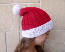 High-quality Image Of A Classic Red Santa Hat With A White Fluffy Brim And Pom Pom Perfect For Christmas Holiday Themes And Festive Decorations High-quality Image Of A Classic Red Santa Hat With A White Fluffy Brim And Pom Pom Perfect For Christmas Holiday Themes And Festive Decorations
