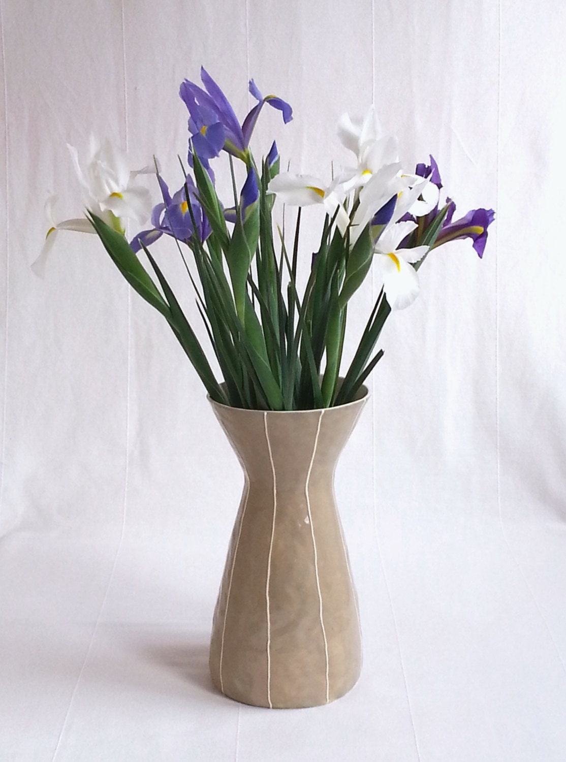 Tall ceramic vase. Simple modern style. Tan with white