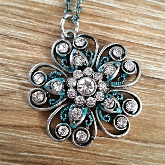 Vintage style charm necklace flower on long oxidized chain.