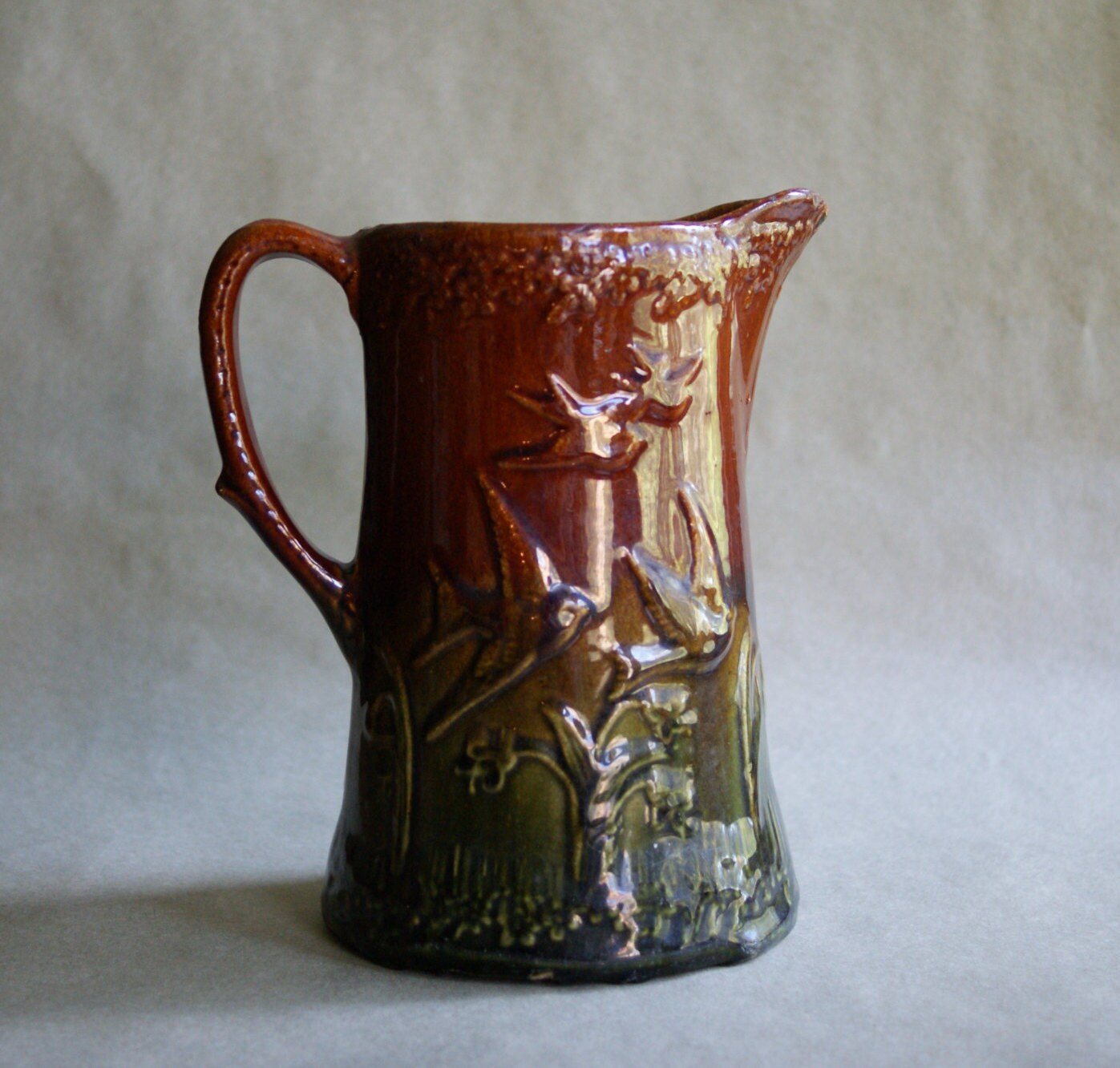 Rare Flying Birds Stoneware Pitcher Green and Brown Blended