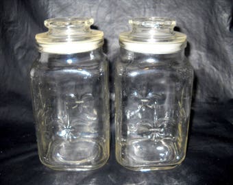Two Fleur De Lis Anchor Hocking 7 Inch Clear Jars Canisters