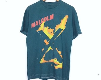 malcolm x with gun shirt