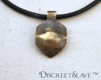 Brass curved non-binary gender fluid shield for masters. Pendant for owners, Dominant or Masters in a BDSM relationship