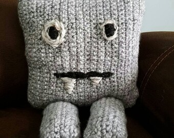 Handmade crocheted monster plush stuffed pillow.