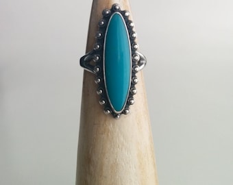 Sterling Silver Maisels Southwestern Style Elongated Marquise Shaped Turquoise Coloured Stone Ring with Pebbled Edges