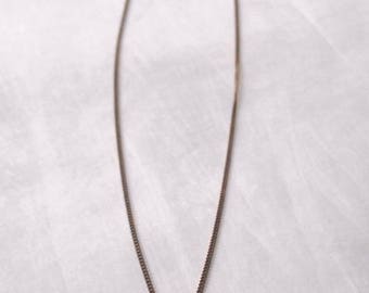 Oxidized sterling silver necklace with oxidized engraved pendant