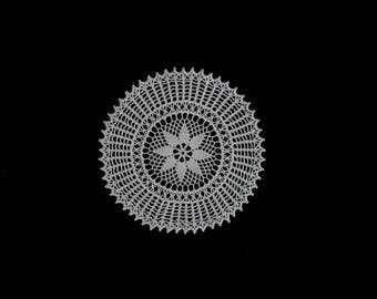 Vintage handmade crocheted doily -- small cream crocheted doily with flower center and spiky edge -- 9 inches / 23cm