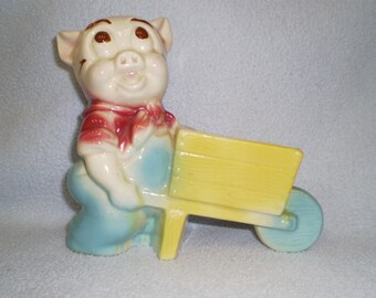 Vintage American bisque pig planter pushing wheelbarrow