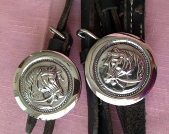 New vintage highly polished stainless steel bridle rosettes featuring 3-D right & left facing horses; classic rope edge; 2 in diameter