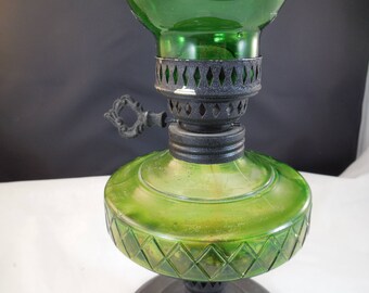 Vintage oil lamp, green and black.