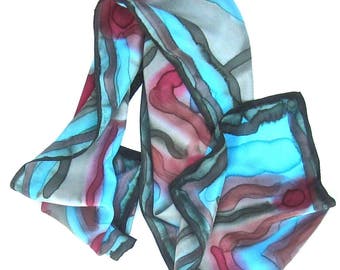 Scarf, hand painted silk, turquoise, olive, red, and orange terra cotta. Handpainted silk scarf, greens red and turquoise.