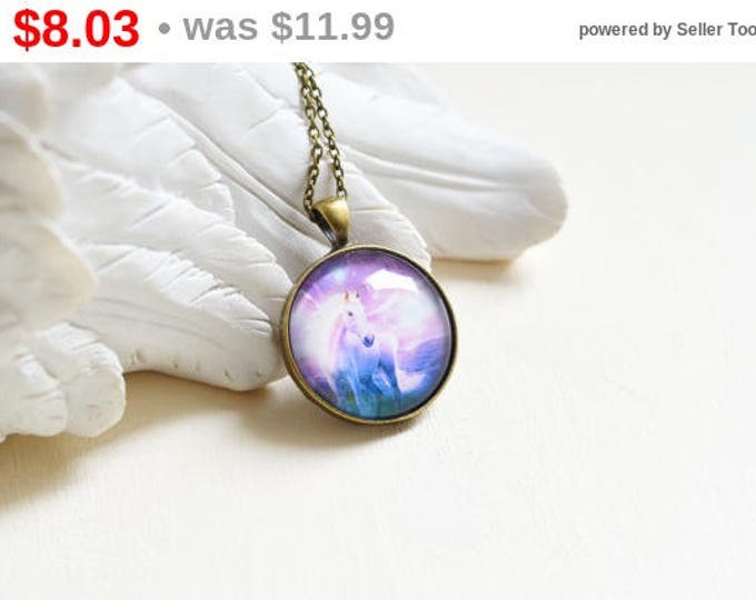 Magic Night // Round pendant metal brass with Pegasus under glass // A horse with wings // Purple, pink, blue, violet