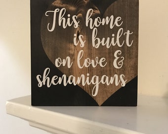 This Home is Built on Love & Shenanigans Stained Wood Sign