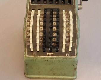 Vintage Hoffritz mini adding machine.