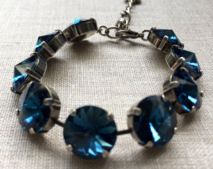 Something blue? Hand-set vintage inspired classic design Swarovski crystal Montana sapphire blue 9 stones 14mm rivoli tennis bracelet.