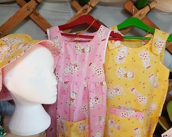 Girls summer dress and matching reversible hat. Pink. Yellow
