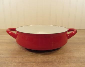 Red enamel Dansk open ware cook pan with side handles- white interior, paella pan
