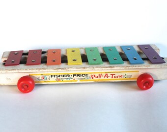 Vintage 1960's Fisher Price Pull A Tune Rolling Noise Maker Toy!