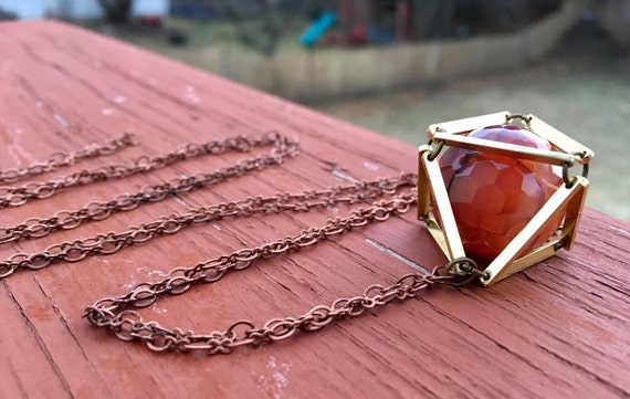 Orange Dragon Veins Caged In Brass Necklace