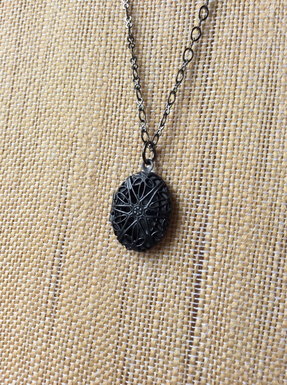 Items similar to Unique small black locket GIFTS WITH A PURPOSE on Etsy