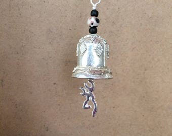 Unique and different ornate silver motorcycle bell with pewter browning deer charm and brown accents.