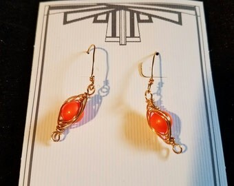Orange wire-wrapped pea pod earrings