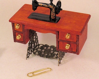 Antique treadle sewing machine 4 opening drawers, moveable foot treadle. 1 to 12 dollhouse scale miniature.Handmade in USA.
