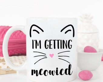 I'm getting meowied coffee mug.Getting meowied.engagement announcement.We're engaged.Engaged.Fiance.Engagement gift.Cat lover.Coffee mug