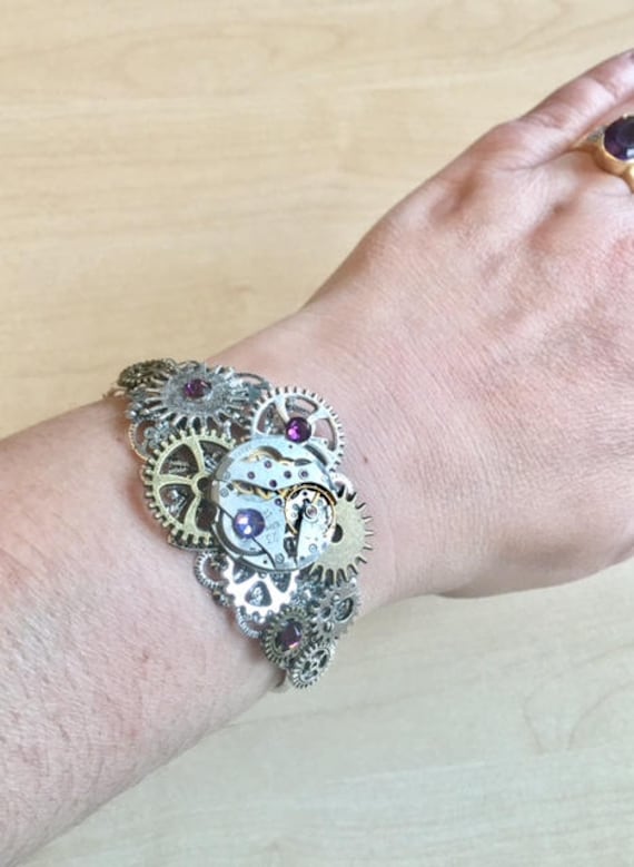 Steampunk silver bracelet with cogs, gears, watch mecanism and purple crystal by Myriambijoux steampunk buy now online