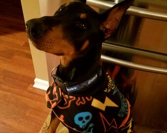 DoberJammies Reversible Fleece Dog Pajamas/Coat Skulls and Bright Orange.