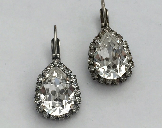 Romantic Hollywood glamour clear Swarovski crystal teardrop pear shape 14x10 drop dangle lever back earrings with a halo of pave.