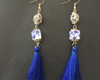 Blue tassel and bead earrings