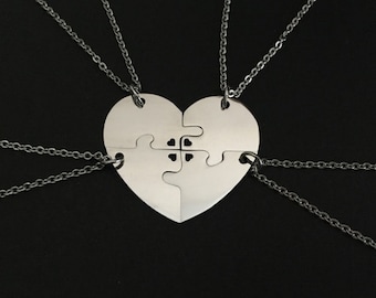 4 Stainless Steel Heart Puzzle Necklaces. 4 Piece Puzzle Necklaces. Personalized Puzzle Necklaces. Matching Puzzle Necklaces. Jigsaw Puzzles