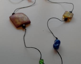 Multi coloured bead necklace with green pendant