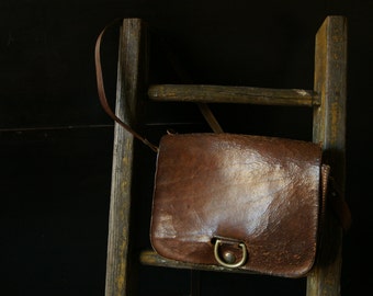 Vintage rusty brown leather hand bag.