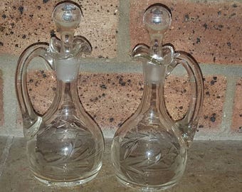 A pair of Vintage etched glass vinegar / oil bottles / vinegarette. With original stoppers