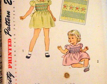Another rare find! Vintag Simplicity Sewing Pattern #1842; ©1946; Child's size 1 dress with smocking; UNCUT AND COMPLETE.
