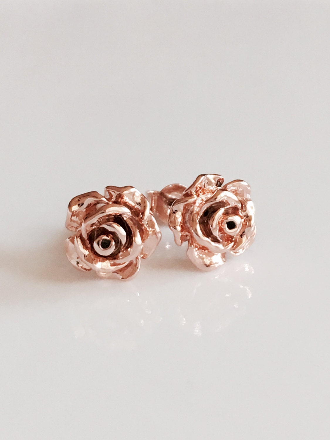 rose stud earrings in rose goldrose gold earringsrose gold